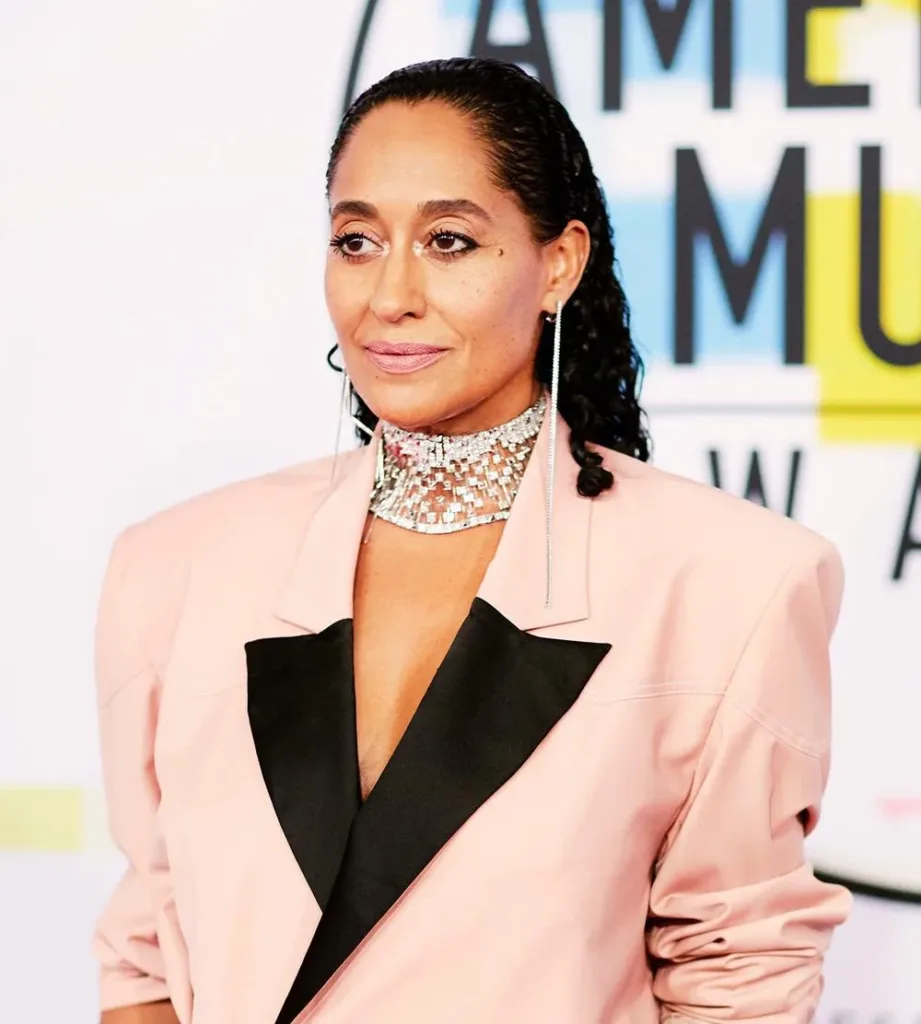 Tracee Ellis Ross in a pale pink suit at an awards event in 2018