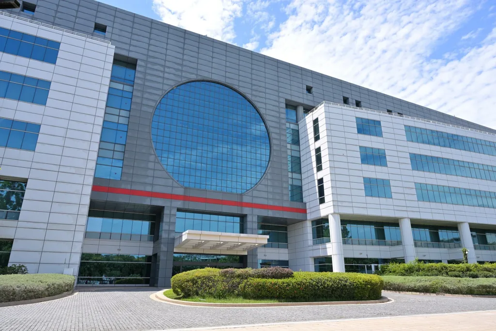 Circular window on the front of TSMC Fab 6 in May 2025