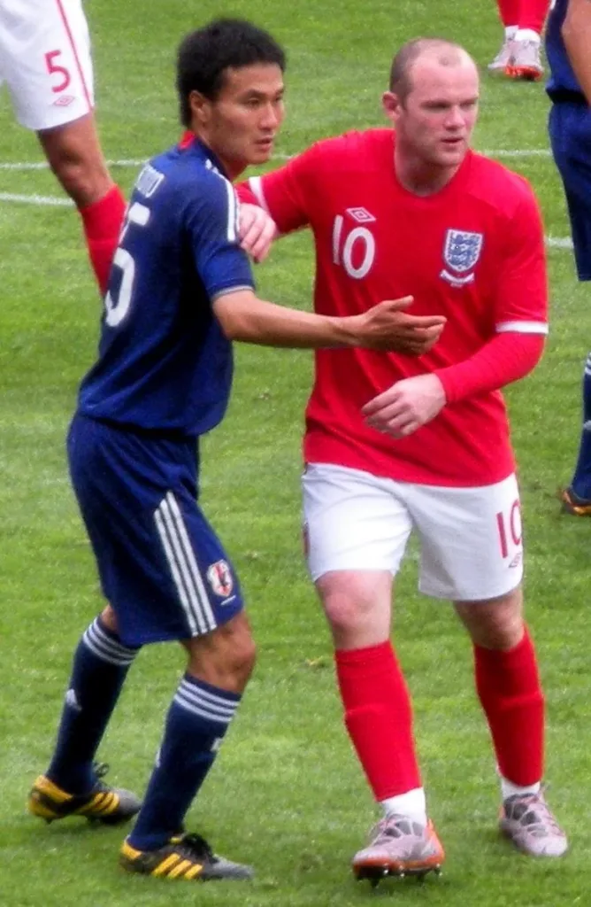 Wayne Rooney with Yasuyuki Konno during England’s May 2010 friendly against Japan