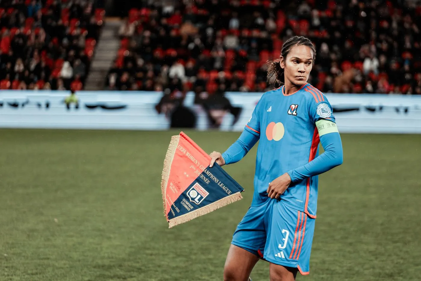 Wendie Renard holding the Lyon pennant before a 2023 match in Prague