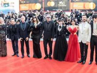 Winona Ryder, sixth from left, with the Beetlejuice Beetlejuice cast and crew at Venice in 2024