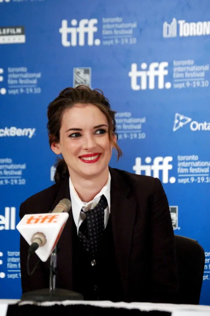 Winona Ryder speaking into a Toronto International Film Festival microphone in 2010