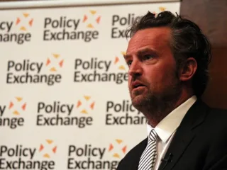 Matthew Perry speaking at a Policy Exchange event in December 2013