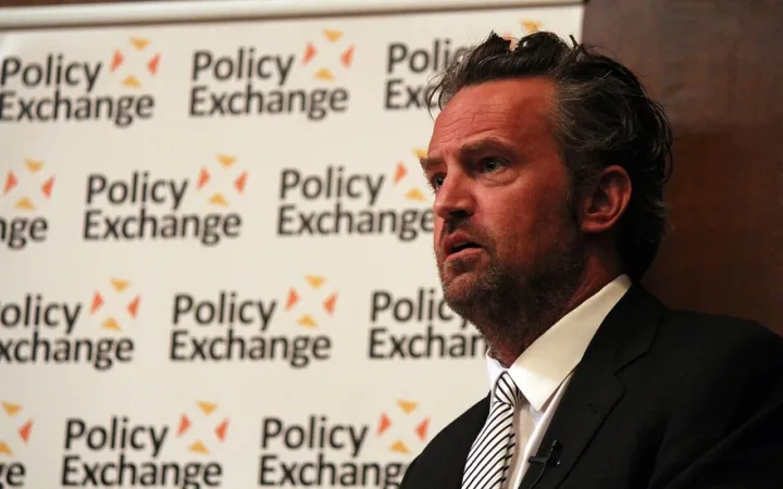 Matthew Perry speaking at a Policy Exchange event in December 2013